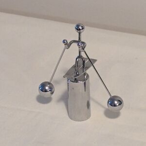 Vintage mod metal balancing kinetic skier Chrome. Perpetual Motion.